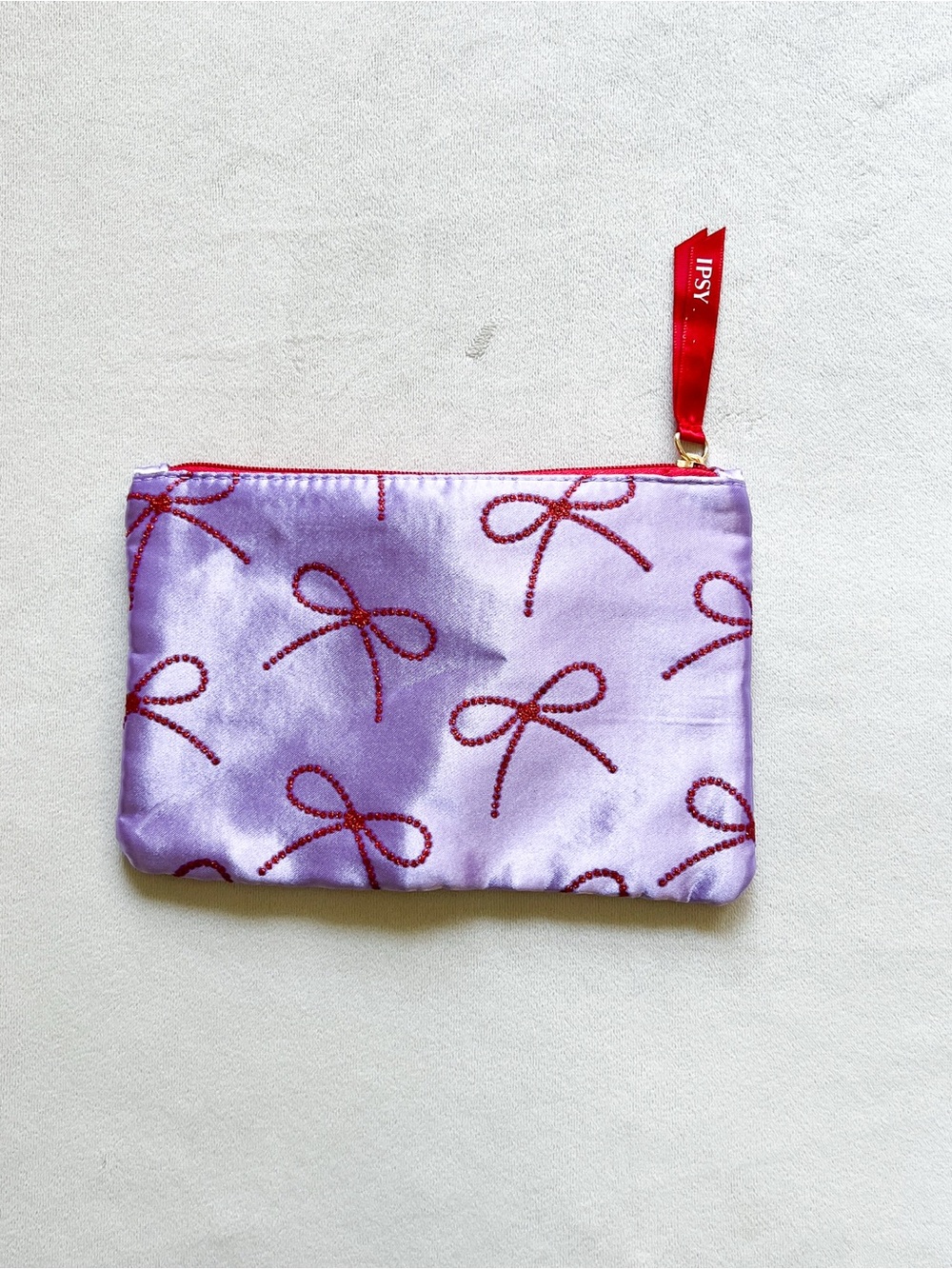 ipsy Lavender Satin Pouch with Red Bow Print